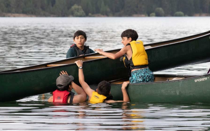 boys canoeing instruction